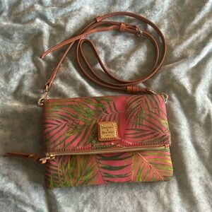Dooney and Bourke- crossbody. Leaf print, coral colored background.